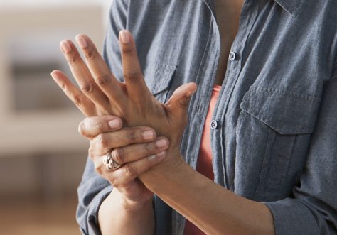 Older-Black-woman-rubbing-her-hands--Arthritis